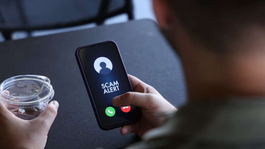 Scam incoming call alert screen on mobile phone.